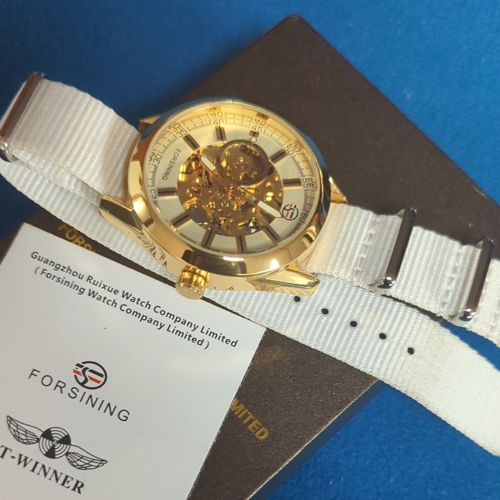 Gold Skeleton Watch with White Strap